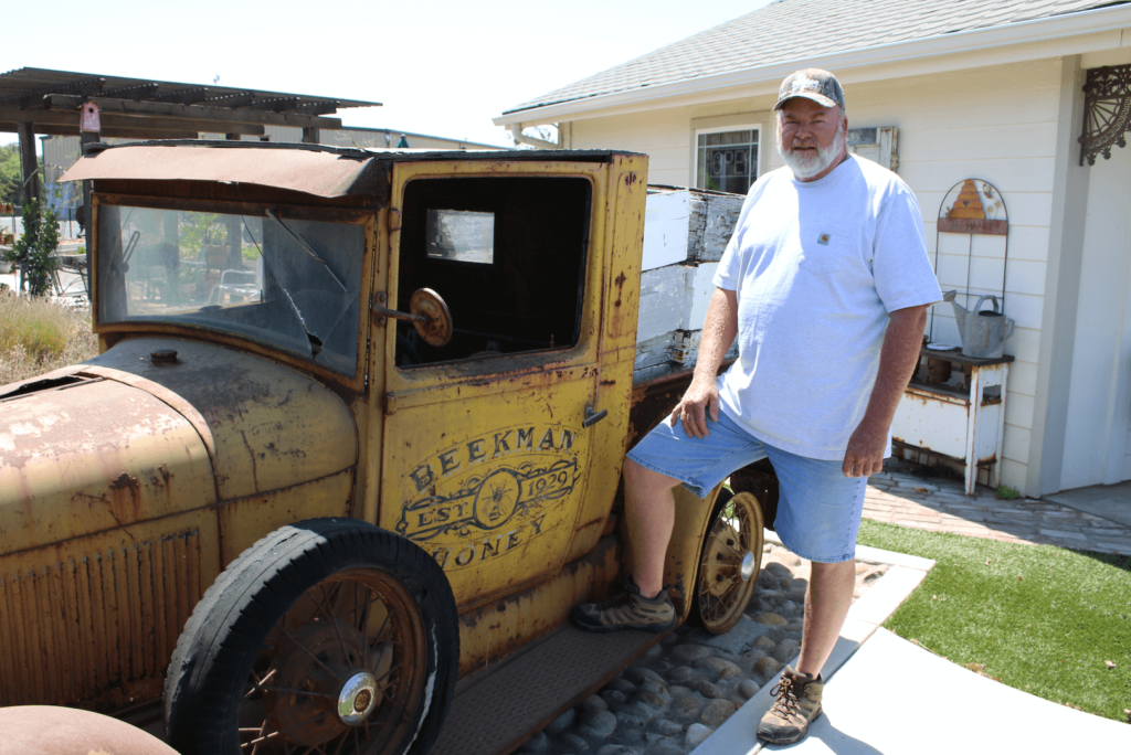 Photo of Bryan Beekman standing next to an antique truck.