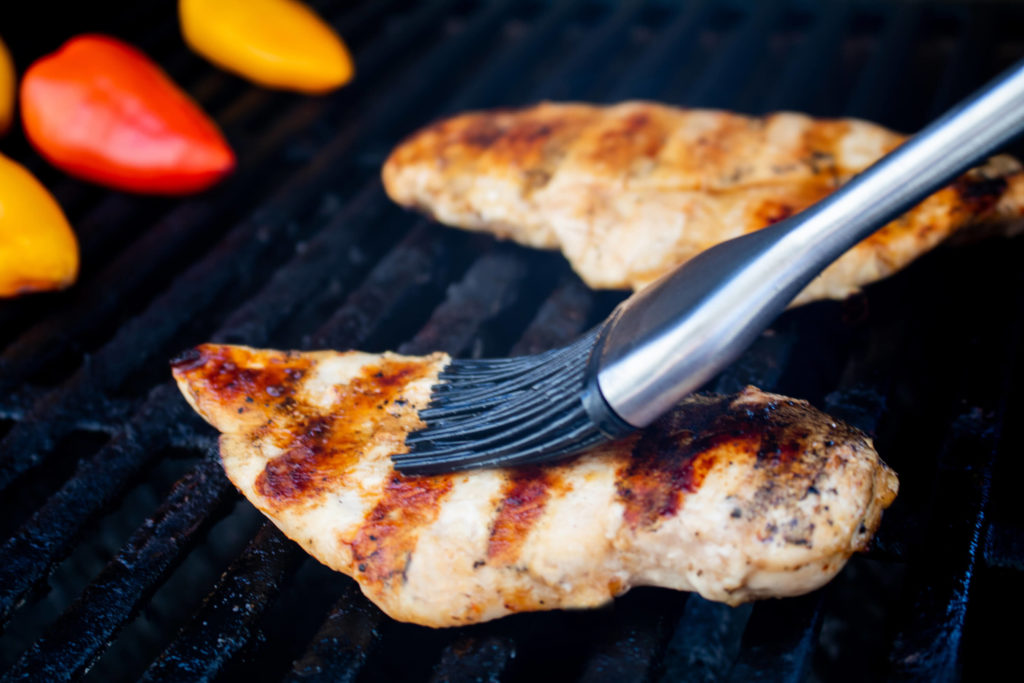 Photo of a grill with chicken. 