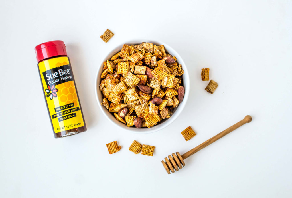 Photo of Sue Bee® honey and Chex mix.