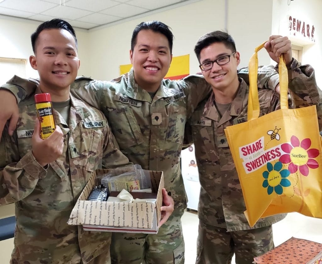 Photo of U.S. service members with care package from Sioux Honey.