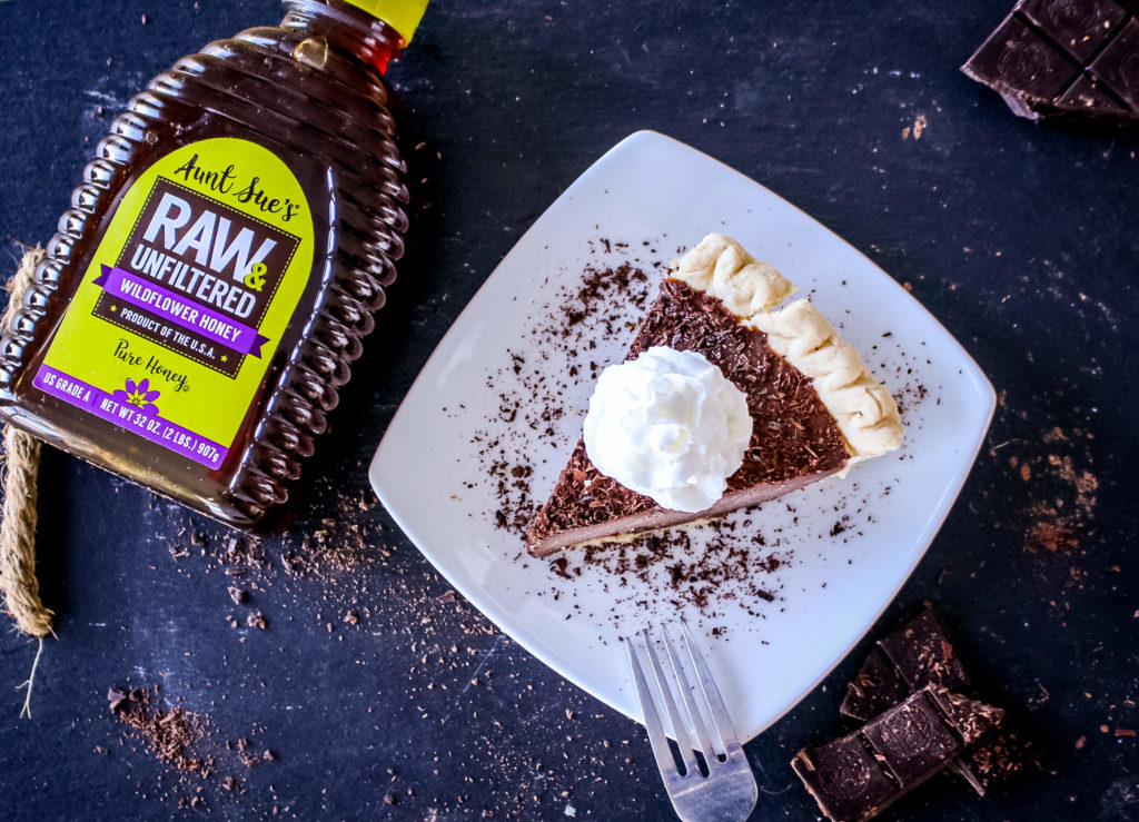 Photo of chocolate pie and AUNT SUE'S® Raw & Unfiltered Honey.