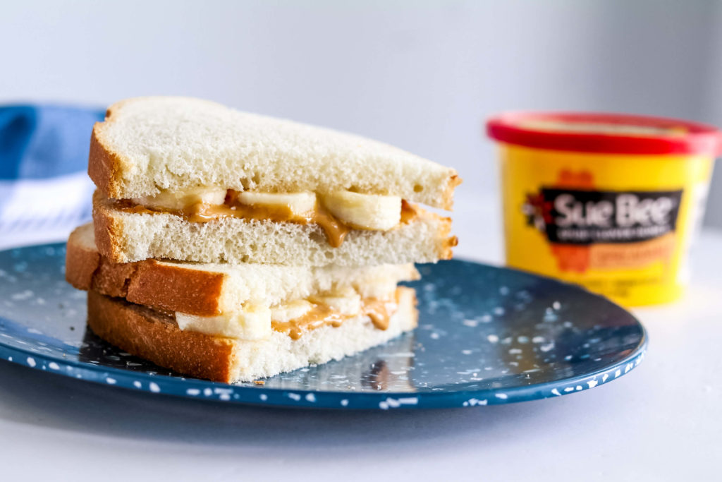 Photo of a peanut butter, banana and honey sandwich. 