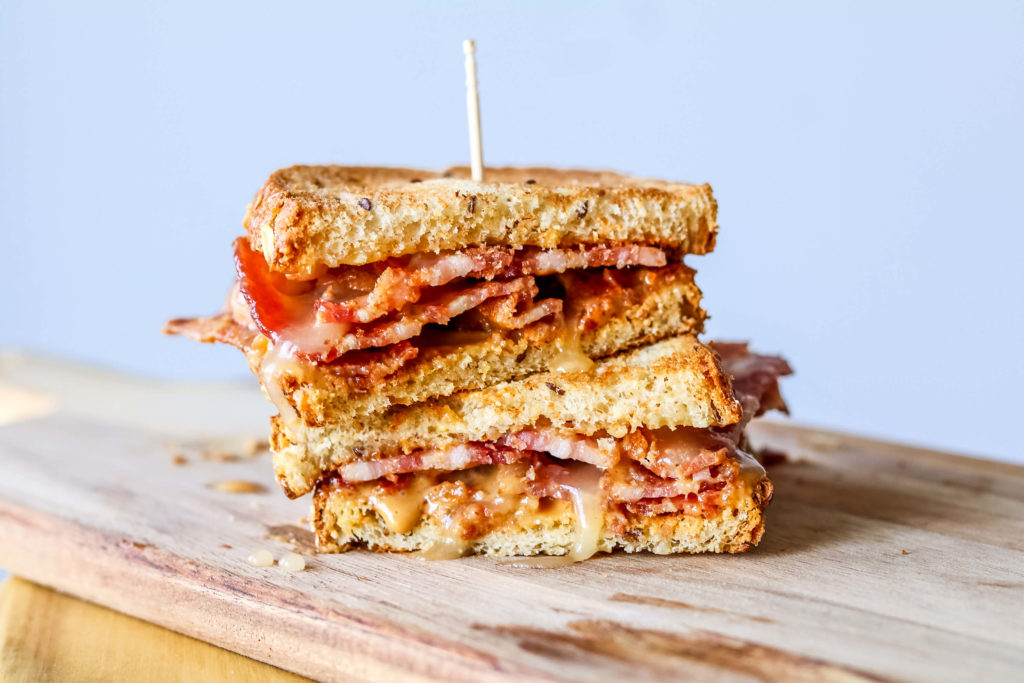 Photo of peanut butter, bacon and SUE BEE® SPUN® honey sandwich.